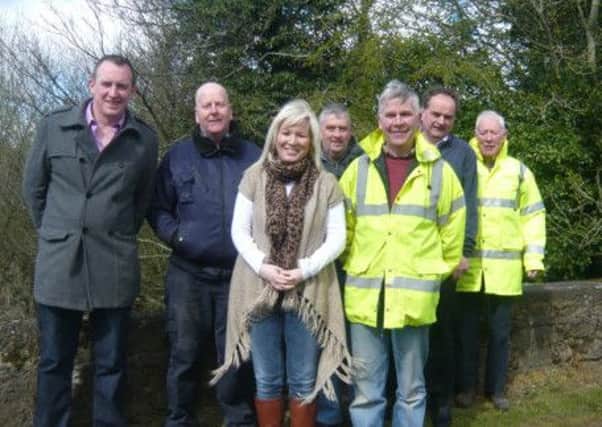 Mid-Ulster MLA Michelle O'Neill (centre) pictured with Sinn Fein Councillor Cathal Mallaghan (first on left) and local residents of The Rock. The MLA has called on Road Service to immediately improve road safety close to a primary school and GAA club.