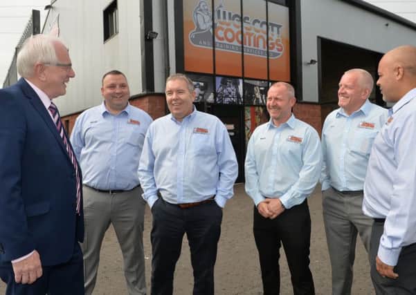 Chairman of Lisburn and Castlereagh City Council's Development Committee, Alderman Allan Ewart, talks to Steve Slack (Operations Manager); Rick McElveen (NI Manager); Mark Nipper (Director); Tom Moyse (Director) and Tommy Whittleton (Director) at the official opening of Wescott Coatings and Training Services Ltd. in Lisburn