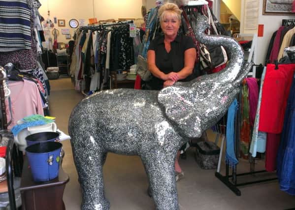 Salvation Army shop manager Jackie Merrell with the elephant statue. INLT-31-702-con