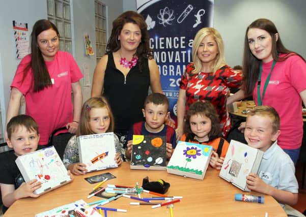 Local children pictured attending a Science & Innovation  Space Camp, programme in the Tower Museum, organised by the legacy department at Derry City and Strabane District Council. Included standing (from left) are facilitator Claire Brolly, Legacy department staff Sheree Brolly and Elsa Edwards and facilitator Erin ODonnelly. 3015-9466MT.