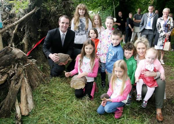 Environment Minister Mark Durkan is pictured with some of the children at Raceview Mill for the opening of the new Hedgehog Hotel. INBT31-204AC