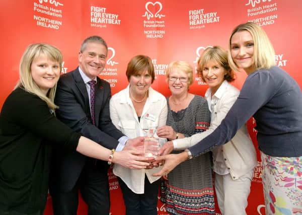 From left to right:  Emma Newell, Hearty Lives Carrick; British Heart Foundation CEO Simon Gillespie; Mary Maxwell Hearty Lives Carrick; Florence Hand (NHSCT); Pat Cusick, Hearty Lives Carrick and Claire Duddy, deputy director, Environmental Services, Mid & East Antrim Borough Council.  INCT 30-724-CON