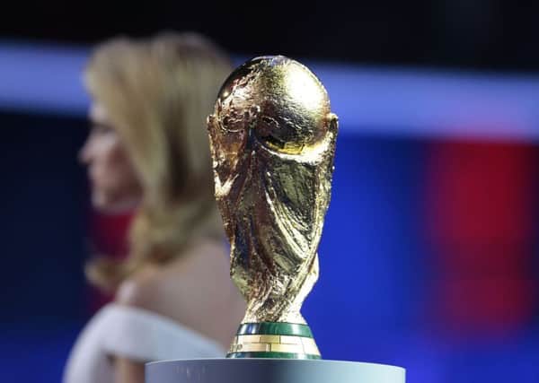 The World Cup trophy is displayed during the preliminary draw for the 2018 finals