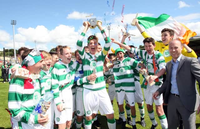 Celtic players celebrate after receiving the trophy. Included is Jonathan Robinson, Hughes Insurance.   Photo Lorcan Doherty Photography