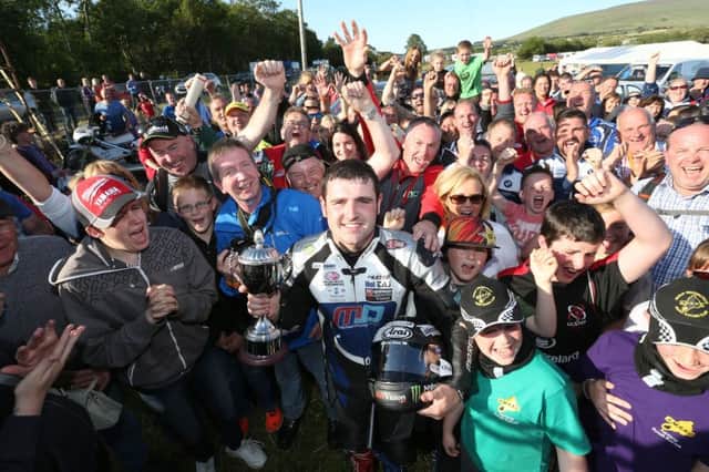 Michael Dunlop celebrates with the Armoy crowd after winning the Race of Legends for the fifth time at the Armoy road races. PICTURE BY STEPHEN DAVISON