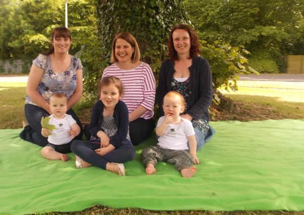 Bridge Integrated P.S, Banbridge with its tiny teachers baby James Topping with his mum Tanya and big sister Grace, Roots of Empathy Instructor Kate Proctor and baby Joe McGarry with his mum Claire.