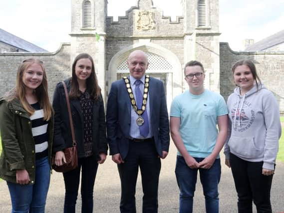 Deputy Mayor of Antrim & Newtownabbey Cllr John Blair who hosted a reception for exchange students at Clotworty Arts Centre last week. Included are, L-R, Ruby Ervine of Ballyclare High School, Jacinda Shelton from Gilbert Arizona, Matthew Audley from Newtownabbey and Cassie Hancock from Gilbert Arizona. INTAT 32-301JC
