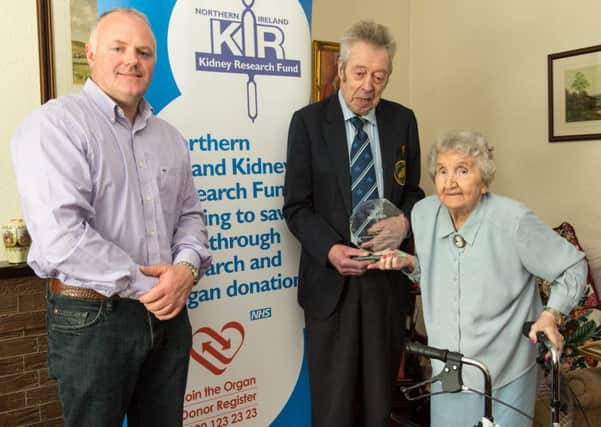 Presentation of award from NIKRF Life President Walter Kerr to Mrs Grace McCullough. Mrs McCullough has helped fund raise an incredible 7.5 million pounds directly for the people of Northern Ireland. Also included id Trevor kinkaid of NIKRF. INLM3015-442