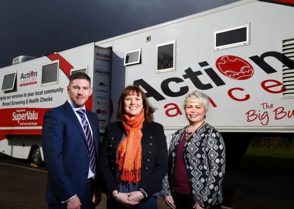 Action Cancer patron Nuala McKeever, centre, joins Sean Conlon from the charity and SuperValu Marketing Manager Donna Morrison, to announce the Big Bus visit to Larne. INLT-31-710-con
