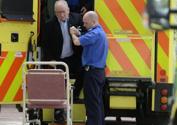 Pacemaker Press 28/7/2015 
Frank McGirr is brought to Craigavon Hospital on tuesday morning, Frank McGirr, 60, appeared at Armagh Court  accused of assaulting Willie Frazer and making a threat to kill him. After the hearing Mr McGirr  was required to sign for alterations to his bail conditions, but apparently slipped and fell to the bottom of the stairs. He was taken away by Ambulance staff to Craigavon.
 Pic Pacemaker