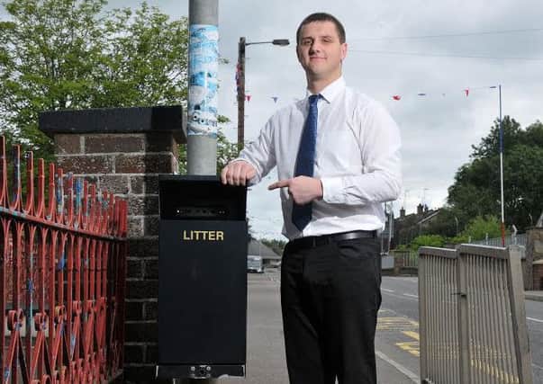Mid Ulster UUP Cllr Mark Glasgow at one of the new dog waste bins on Urbal Road, Coagh