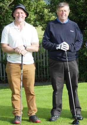 Michael Pollins, winner of the Lisburn Fuels competition at Lambeg GC along with Mervyn White.