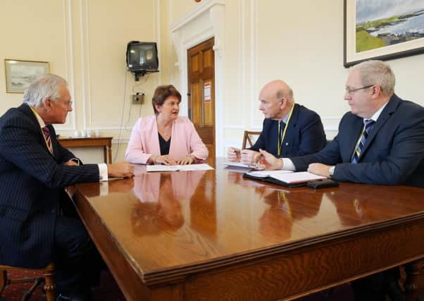 Press Eye - Belfast  Northern Ireland - 23rd July 2015 - 

Finance Minister Arlene Foster is pictured during a meeting with the trustees of Air Ambulance NI Ltd to discuss the setting up of an air ambulance to serve Northern Ireland.

The DUP MLA is pictured with trustees (l-r) Ian Crowe, Peter Quinn and Ray Foran.

Picture by Kelvin Boyes / Press Eye.