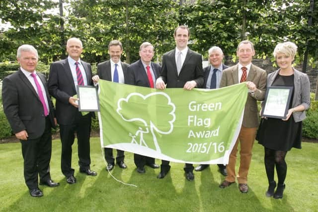 Pictured with the Green Flag Awards presented to Lisburn & Castlereagh City Council are: (l-r) Ross Gillanders, Head of Service (Leisure Services); Jim Rose, Director of Leisure & Community Services;Tony Wilcox, Chairman of Keep Northern Ireland Beautiful; Alderman Paul Porter, Chairman of the Council's Leisure & Community Development Committee; Minister for the Environment Mark H. Durkan; Ian Humphreys Chief Executive Keep Northern Ireland Beautiful and Kim Moore, Heyn Waste Solutions.