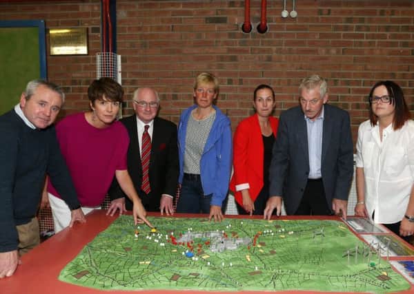 Members of Kells Vocal with a model of the area and how the proposed Solar Farm would look at Tuesday evening's public meeting in Kells & Connor Community Centre. Included are Mervyn McMullan, Jane Burnside (vice-chairperson), Tom McGarry Arthurs, Nikki Nesbett, Pamela Dennison (secretary), Ed Crawford (chairman) and Eileen Russell. INBT 32-101JC