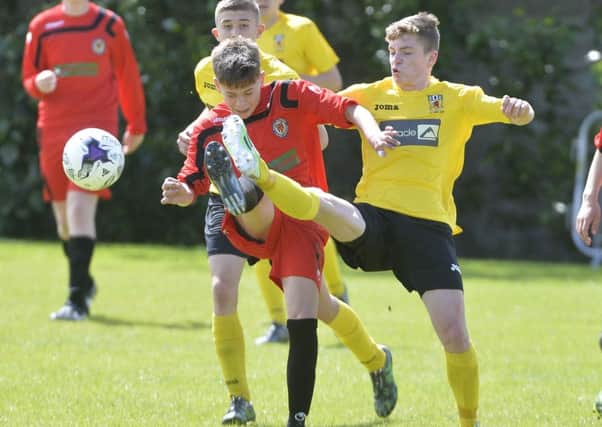 Londonderry's  Jack Malone in action with Antrims Marc McKenna