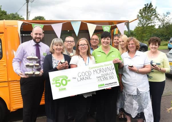 Volunteers from Good Morning Larne with Niall Keyes, General Store Manager, Asda Larne (left), Barbara Ann Gilchrist, Good Morning Larne Co Ordinator and Catherine McCallion, Community Life Champion at Asda Larne (centre) INLT-32-701-con