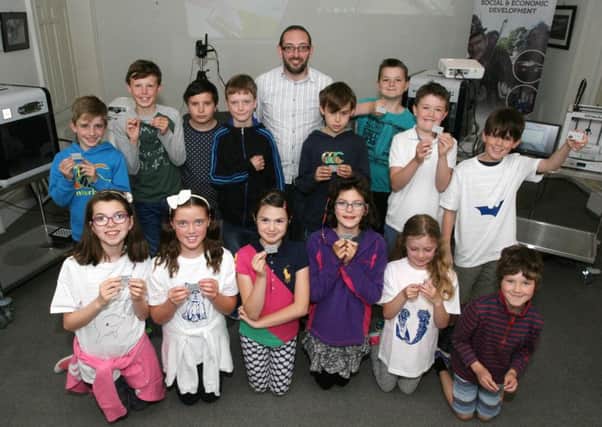 Charlie Smyth (tutor) and children pictured during the launch of the Fab Lab at Flowerfield Arts Centre. The event is funded by Department of Culture, Arts and Leisure with support from the Nerve Centre. INCR33-306PL