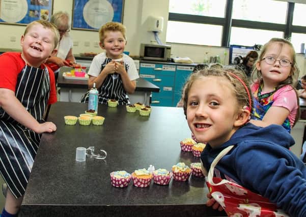 Mia and friends enjoying making cup cakes at Jordanstown School summer scheme. INNT 29-523-SO