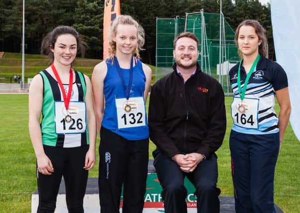 Pictured with Joe Diver of firmus energy are Hannah Vogan (centre) from Banbridge Athletic Club; Natalie Cahoon (left) from Ballymena and Antrim Athletic Club and Alannah Wilson (right) from Lagan Valley Athletic Club who came first, second and third respectively in the Under 17 Girls 100 metres.
