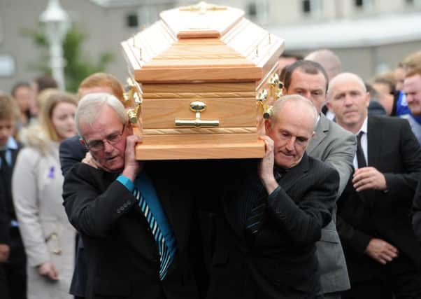 Mourners carry Aaron's coffin into St Patrick's Church, Ballinderry