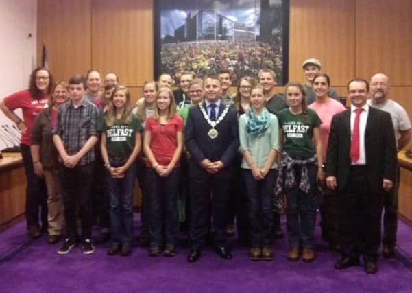 Mayor Thomas Hogg and Cllr Paul Hamill show the Teen Missions International team the council chamber during their visit to Antrim and Newtownabbey Council's Mossley Mill headquarters. INNT 32-505CON