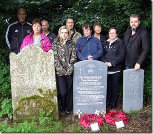 Members of the Carson Project (Ballymena) and the Ulster Covenant & Historical Society visit Private Meeke's grave. inbm33-15