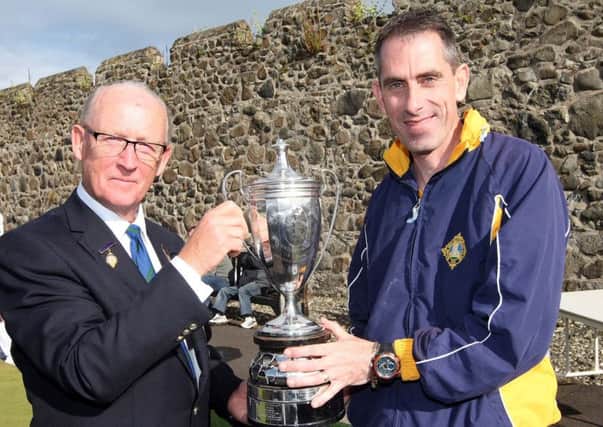 Ken Armstrong President of NIBA presents Martin McHugh of Whitehead Bowling Club with the NIBA Singles Trophy