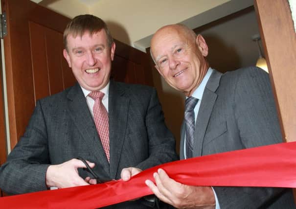 Social Development Minister Mervyn Storey MLA and Timothy Quin, Chair of Choice Housing Association cut the tape to officially open The Lodge, a new housing scheme in Antrim for adults with mental health issues