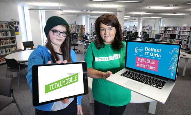Idun Craig, 15, (left)  with Ashley Ball from TotalMobile, is taking part Belfast Metropolitan Colleges first female-focussed IT summer camp, Belfast IT Girls.