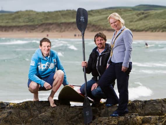 Mayor of Causeway Coast and Glens Borough Council, Councillor Michelle Knight-McQuillan with Ashley Hunter of the Canoe Association of Northern Ireland CANI and world champion surf kayaker, Johnny Bingham.