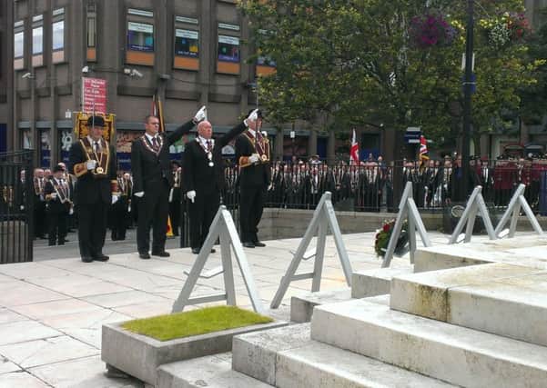 The Governor of he Apprentice Boys Jim Brownlee, leads the tribute, Act of Reflection and Salute at the Cenotaph in The Diamond.