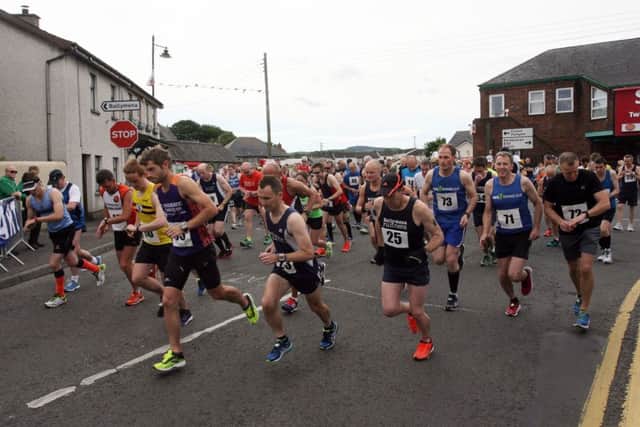 Runners get under way at the start of the Kells and Connor half marathon and fun run, raising money for MS and Macmillan Cancer Support. INBT33-243AC
