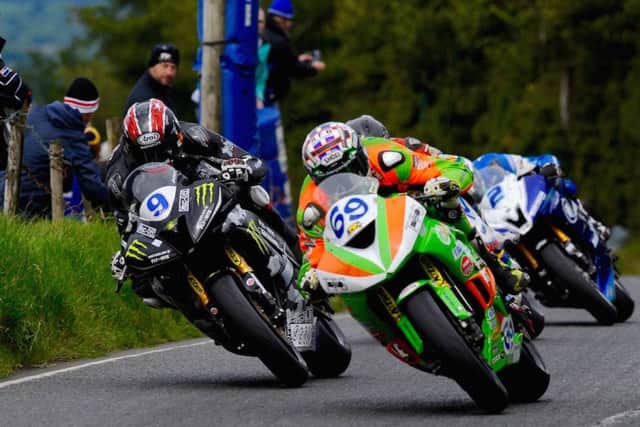 Glenn Irwin (69) passing Ian Hutchinson (9) at the Ulster Grand Prix. INLT 33-906-CON