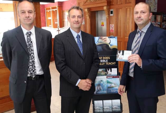 From left - David Daly, Stuart Cummins and Chris Panduro from the Ballymoney congregation of Jehovah's Witnesses pictured at the first ever public meeting in Ballycastle.