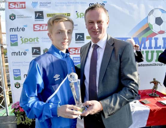 Jack Chambers is presented with the Bertie Peacock Trophy by Northern Ireland manager Michael O'Neill. Picture by Stephen Hamilton / Press Eye.