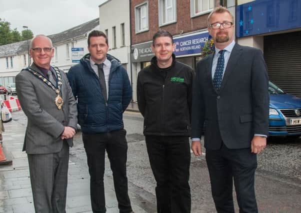 Local traders have come together to celebrate the first phase of the Ballymena Public Realm Works which have been completed slightly ahead of schedule this week. Pictured from left Mayor of Mid and East Antrim , Councillor Billy Ashe,  Bryan Glass Woodside Pharmacy and Gerry McClean  The Music Rooms, and Peter Day  Ballymena BID Manager. (Submitted Picture).
