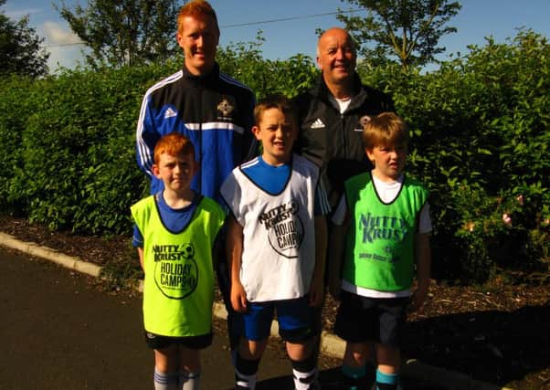 Coaches Ally McIlroy and Ian Getty with players from Irish FA Nutty Krust Summer Camp.