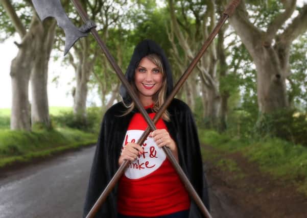 Sarah Travers gets into character along the Kings Road from Game of Thrones to help launch Northern Ireland Chest, Heart & Strokes Causeway Coast Challenge Walk on 26th September 2015.
