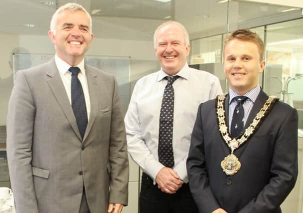 Jonathan Bell MLA, Minister for Enterprise Trade and Investment, with Barry Mulhern, Managing Director of CMASS, and Mayor Thomas Hogg. INNT 31-500-SO