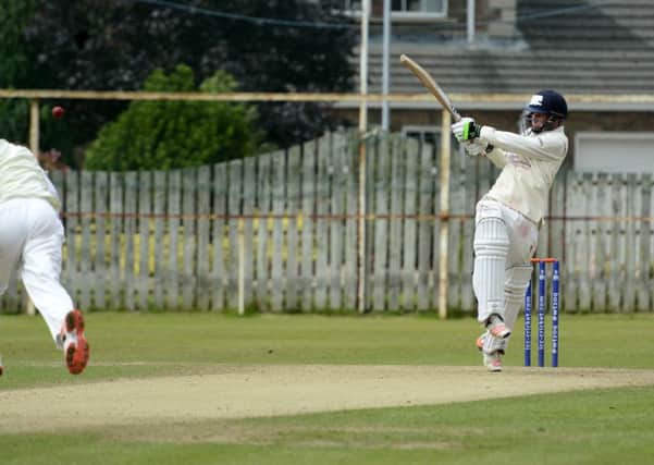 Man of the match Andrew McBrine hits a four for Donemana. Picture by Keith Moore/Press Eye