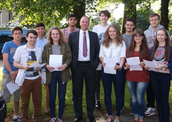 Foyle College Principal Patrick Allen with pupils who achieved three or more As at A-Level, from left: Ethan Lapsley, Andrew Martin, Sarah Ferry, Wasi Quereshi, Frank Duffy, Alex Browne, Jack taylor, Jade Gould, Rodger Long, Ruth Allen.