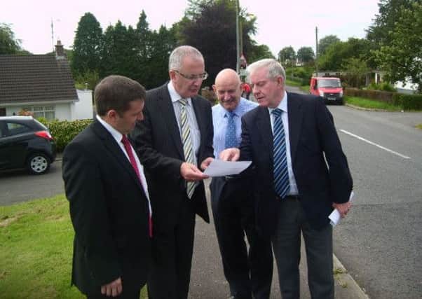 Flashback to 2011: North Antrim UUP MLA Robin Swann discusses the Woodtown Road improvement scheme with Roads Minister Danny Kennedy and Ballymena UUP Councillors Robin Cherry and James McClean.