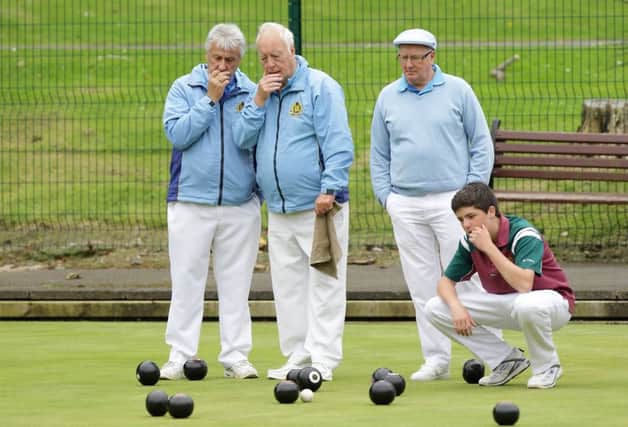 Studying the bowls in the match between Lisnagarvey B and Rathfriland, at Warren Gardens. US1534-512cd  Picture: Cliff Donaldson