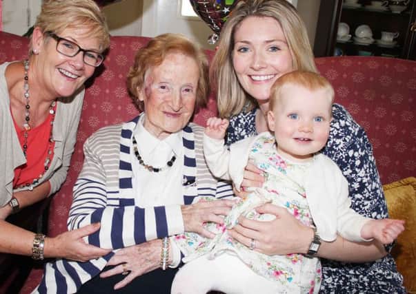 Portstewart woman Beattie Taylor celebrated her 100th birthday last Monday with her daughter Pearl Stewart (left), grandaughter Emma Forrest, and great grandaughter Beth Forrest. PICTURE: MARK JAMIESON.