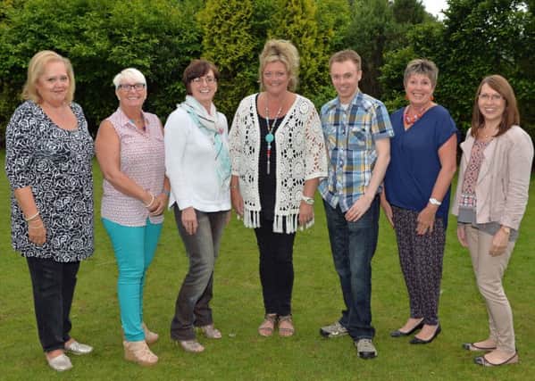 Members of the Courtyard Community Choir pictured with their chairperson, Judith McVeigh (left). INNT 32-010-PSB