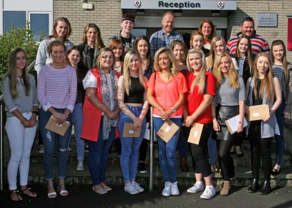 AS level students from Cullybackey College who achieved excellent grades are pictured with David Donaldson (Principal), Tim Manson (V0ce-principal) and Donna Wilkinson (Head of Sixth Form). INBT34-201AC