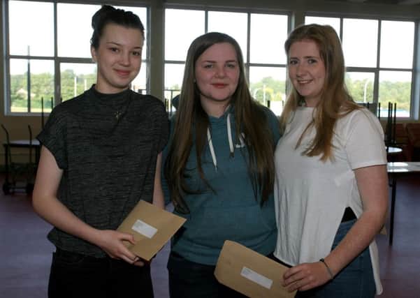 Samantha Dennison, Laura McKeown and Lois Manson, from Dunclug College, celebrating their AS level results. INBT34-202AC