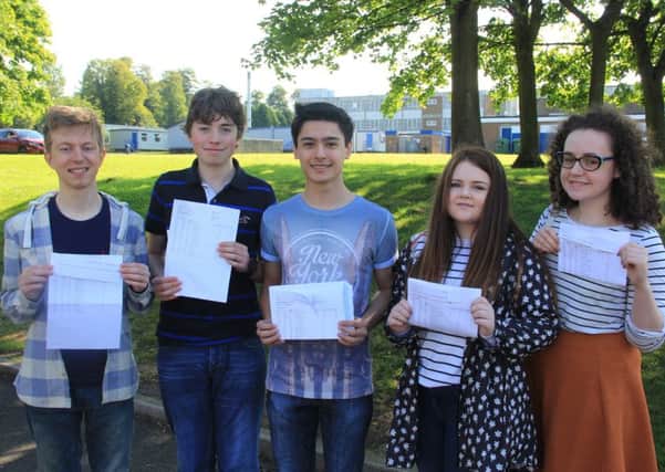 Pictured with their A Level results are Matthew Dobson, Ben Collister, Kyle hill, Becca McKnight- Ireland, Kirstin Sinclair.