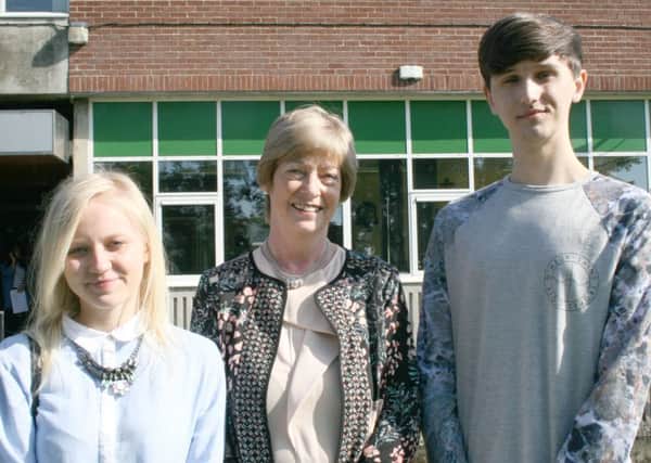 Mrs Magee with highest achieving students Aleksandra Krol  and Jakub Bojanowski (missing from picture: Niall McCarry). Submitted.